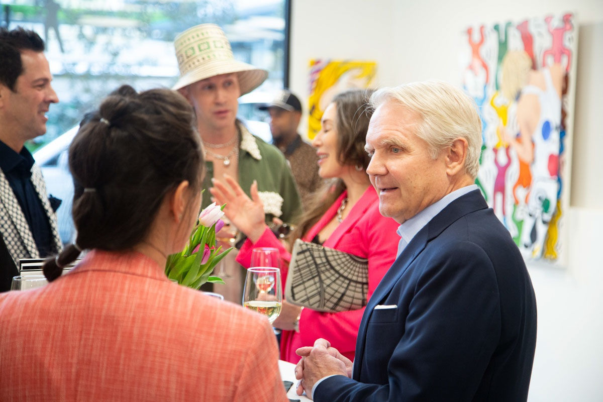 People at Carousel Fine Art's gallery space in Buckhead Village, Atlanta during the Caroline Dechamby Retrospective.