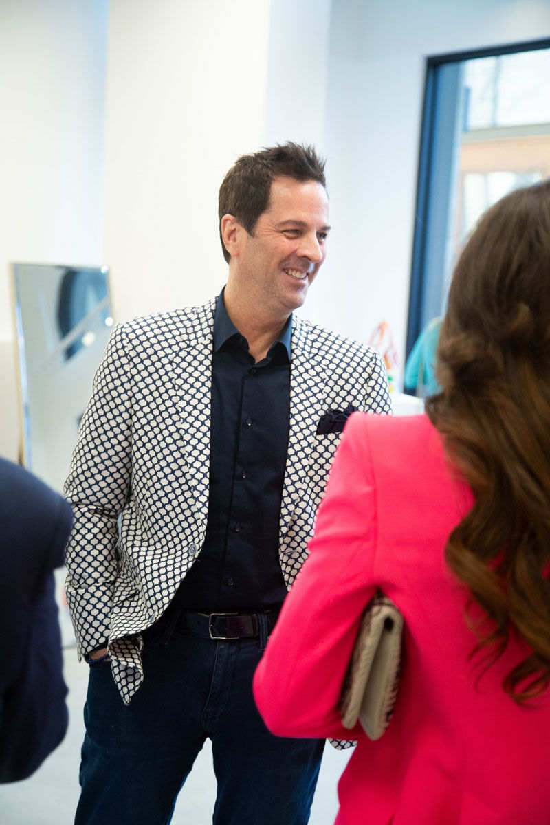 People at Carousel Fine Art's gallery space in Buckhead Village, Atlanta during the Caroline Dechamby Retrospective.