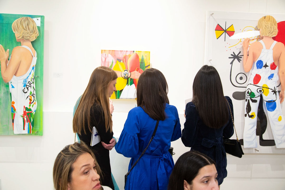 People at Carousel Fine Art's gallery space in Buckhead Village, Atlanta during the Caroline Dechamby Retrospective.