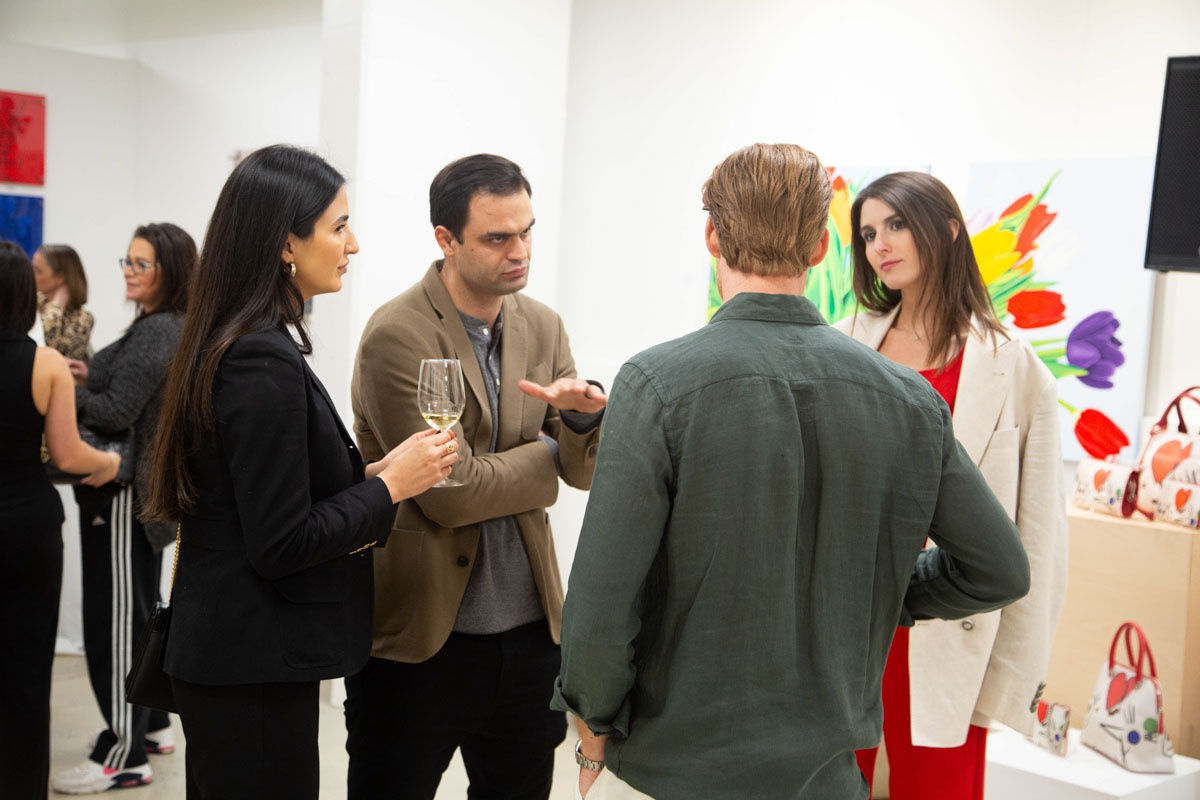 People at Carousel Fine Art's gallery space in Buckhead Village, Atlanta during the Caroline Dechamby Retrospective.