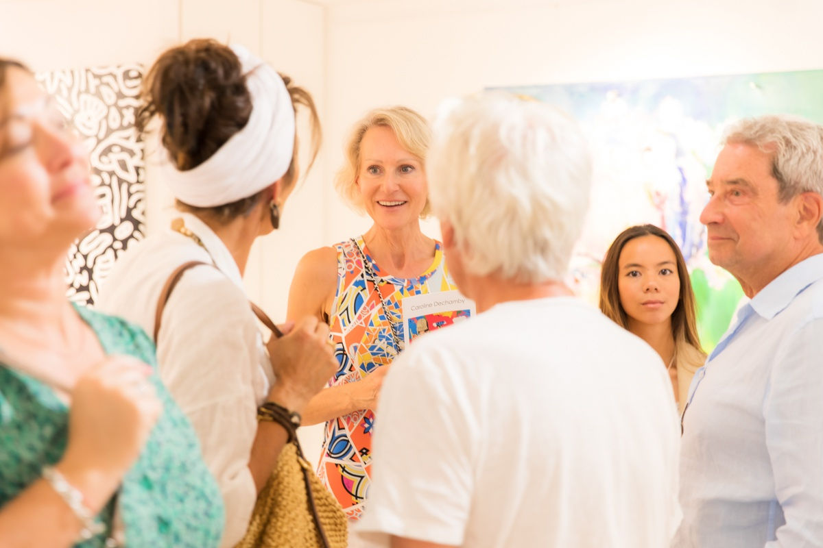 People inside of Carousel Fine Art's gallery space in Saint Tropez.