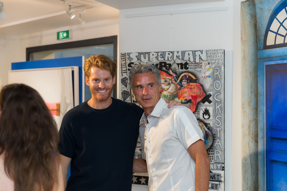 People inside of Carousel Fine Art's gallery space in Saint Tropez.