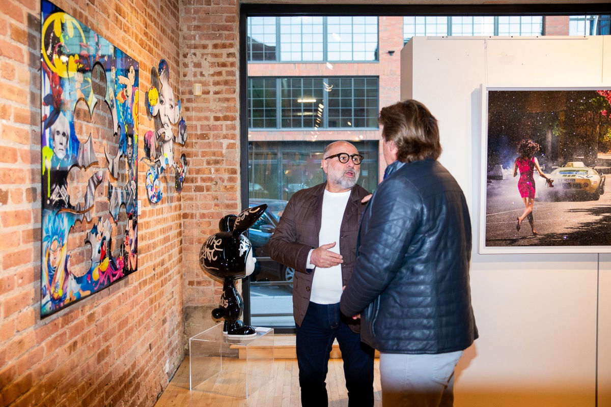 People in Carousel Fine Art's Chicago gallery space.