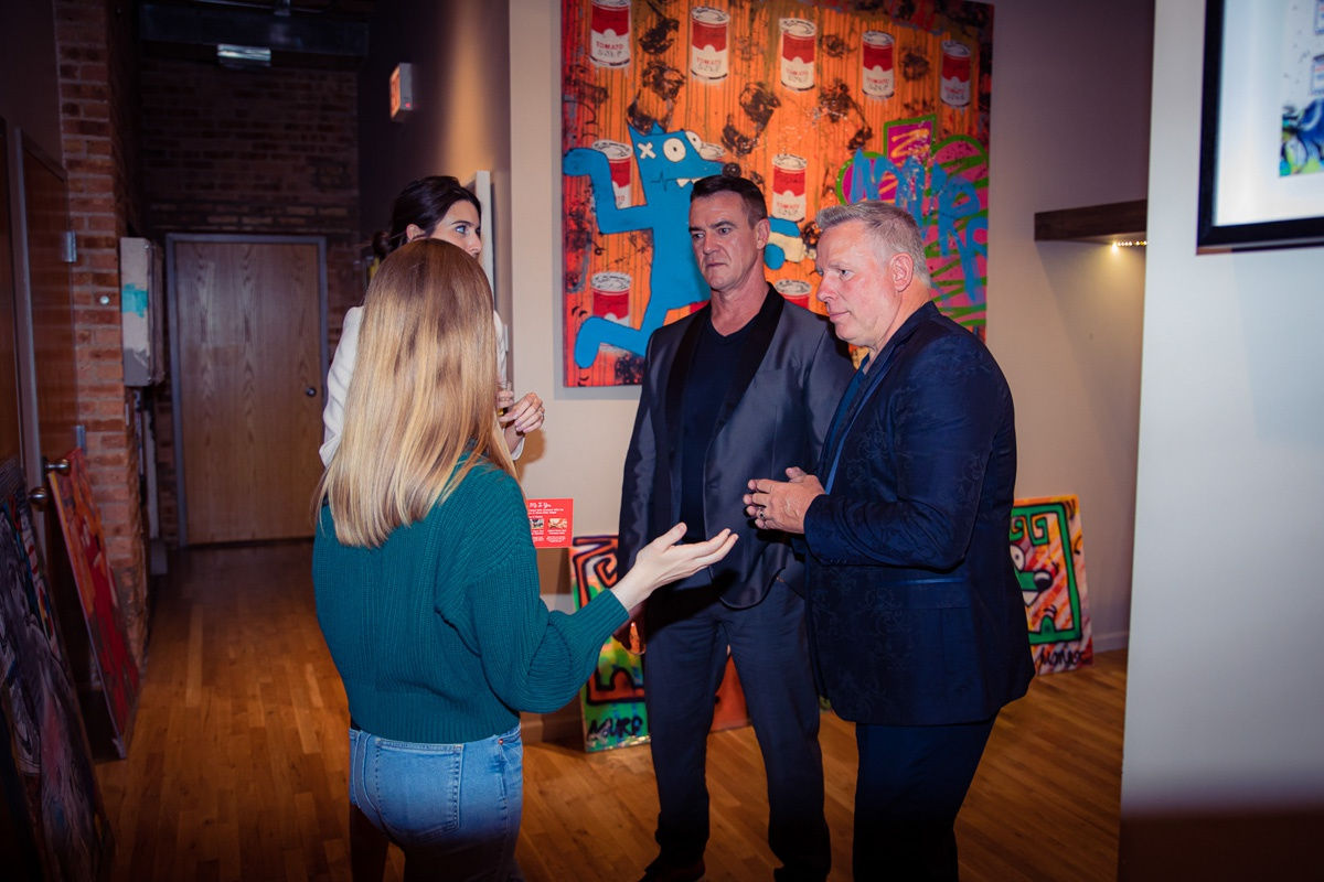 People in Carousel Fine Art's Chicago gallery space.