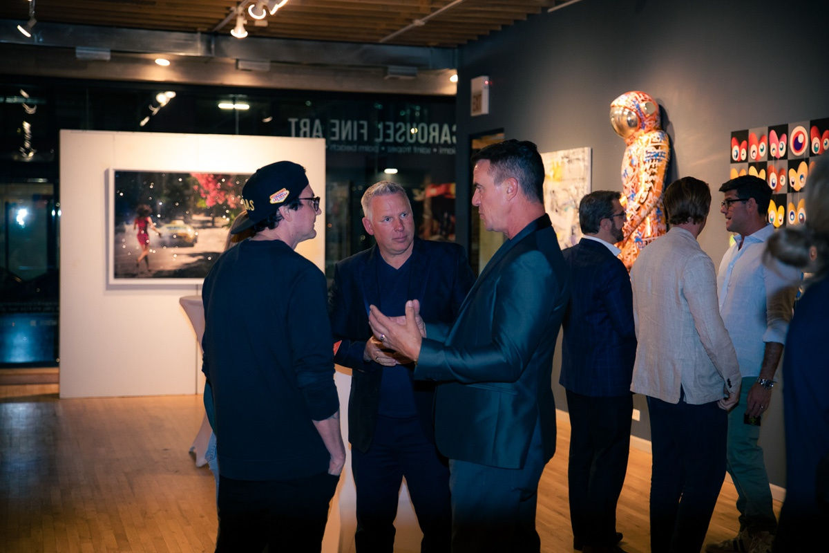 People in Carousel Fine Art's Chicago gallery space.