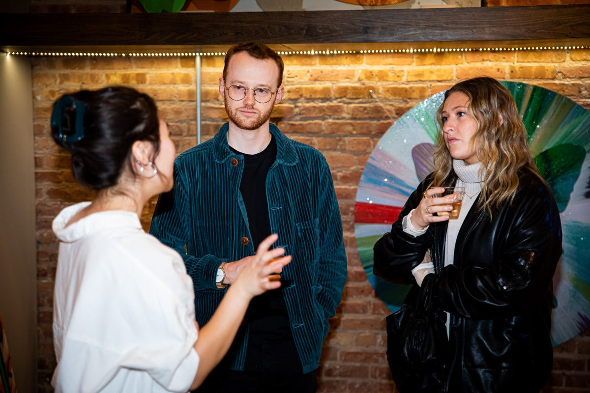 People in Carousel Fine Art's Chicago gallery space.