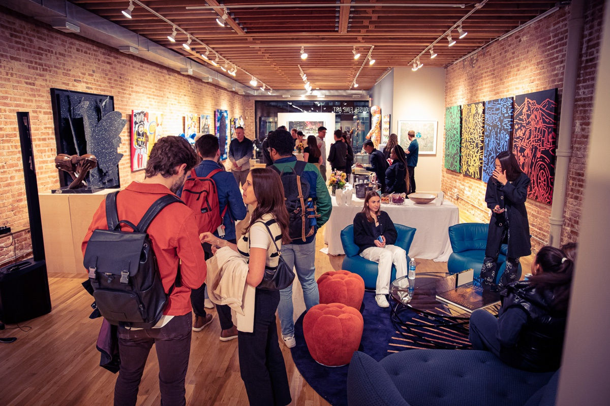 Crowd of people in Carousel Fine Art's Chicago gallery space.