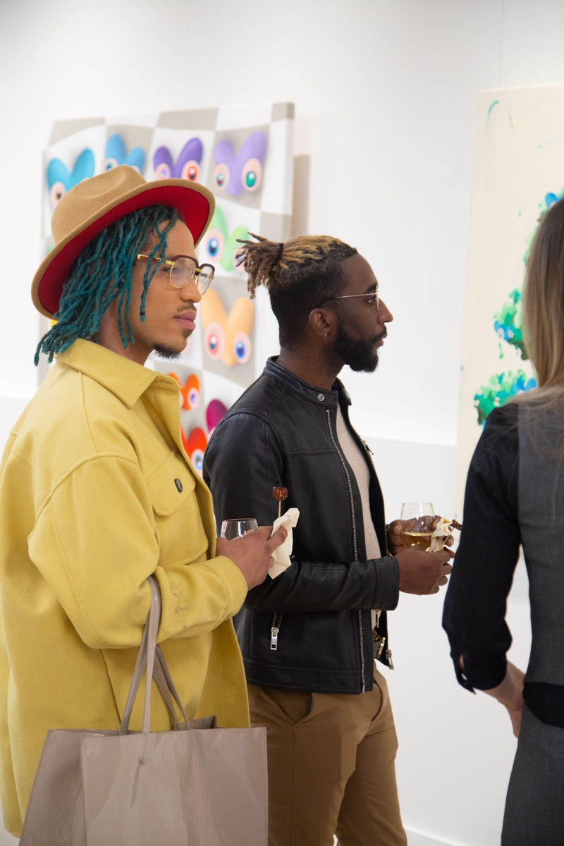 People in Carousel Fine Art's Atlanta gallery space during the spotlight exhibition for John Westbay titled "Love, Outside the Lines."