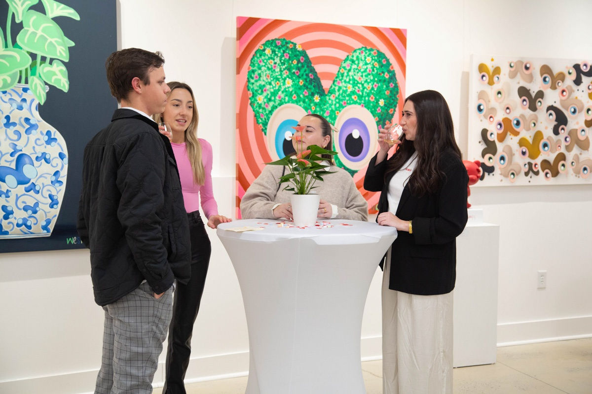 People in Carousel Fine Art's Atlanta gallery space during the spotlight exhibition for John Westbay titled "Love, Outside the Lines."