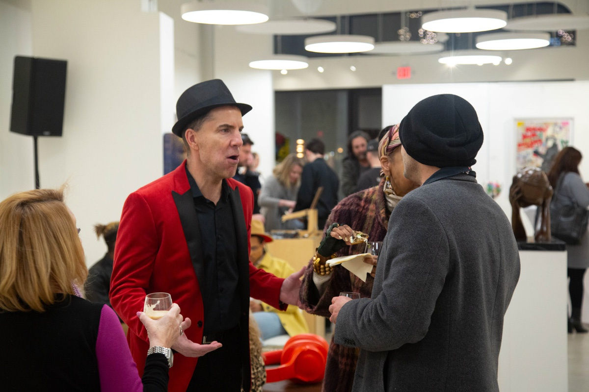 People in Carousel Fine Art's Atlanta gallery space during the spotlight exhibition for John Westbay titled "Love, Outside the Lines."