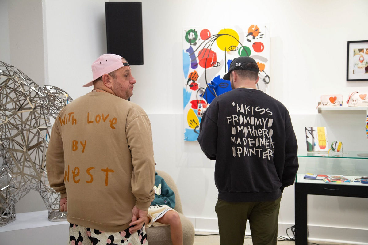 People in Carousel Fine Art's Atlanta gallery space during the spotlight exhibition for John Westbay titled "Love, Outside the Lines."