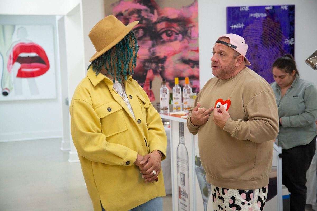 People in Carousel Fine Art's Atlanta gallery space during the spotlight exhibition for John Westbay titled "Love, Outside the Lines."