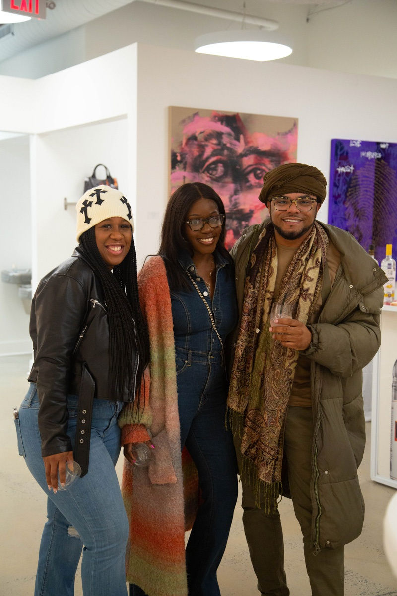 People in Carousel Fine Art's Atlanta gallery space during the spotlight exhibition for John Westbay titled "Love, Outside the Lines."