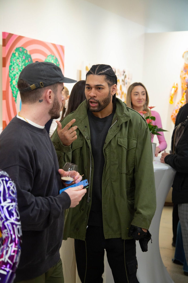 People in Carousel Fine Art's Atlanta gallery space during the spotlight exhibition for John Westbay titled "Love, Outside the Lines."