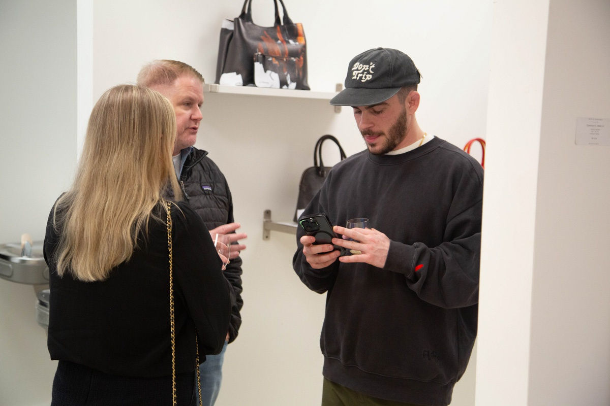 People in Carousel Fine Art's Atlanta gallery space during the spotlight exhibition for John Westbay titled "Love, Outside the Lines."