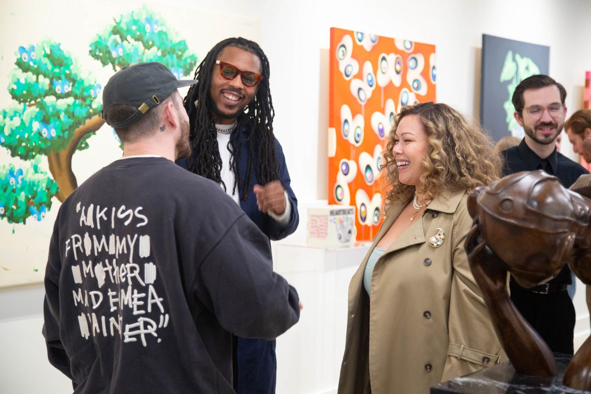 People in Carousel Fine Art's Atlanta gallery space during the spotlight exhibition for John Westbay titled "Love, Outside the Lines."