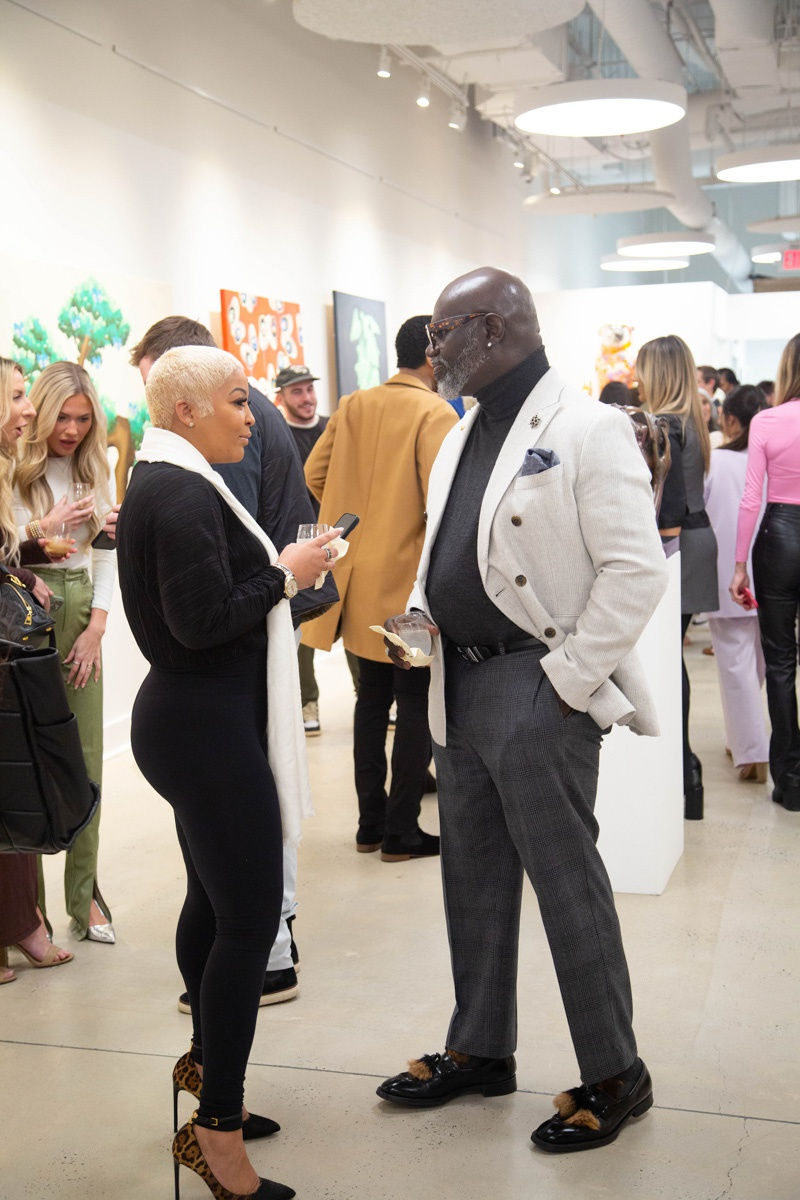People in Carousel Fine Art's Atlanta gallery space during the spotlight exhibition for John Westbay titled "Love, Outside the Lines."