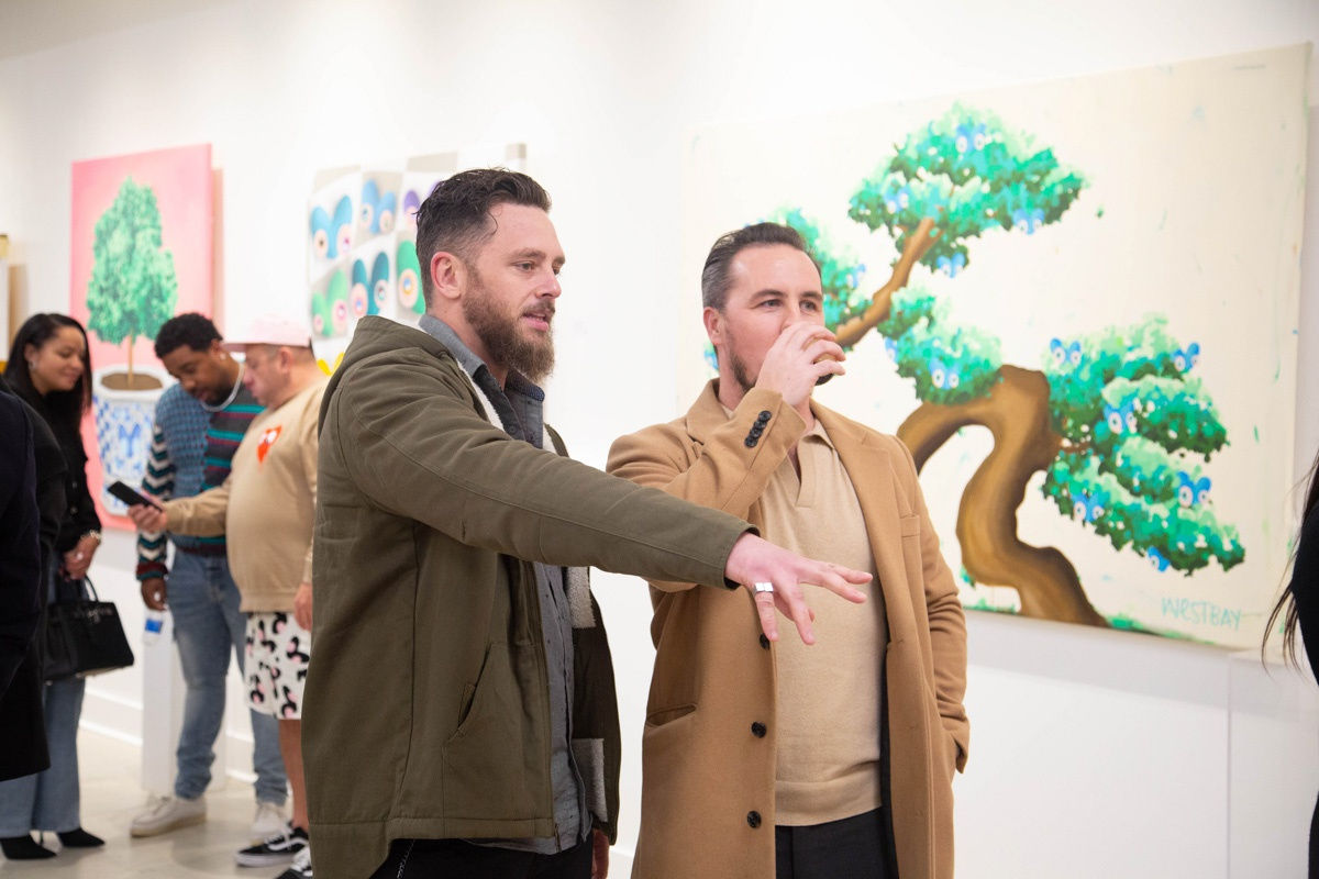 People in Carousel Fine Art's Atlanta gallery space during the spotlight exhibition for John Westbay titled "Love, Outside the Lines."
