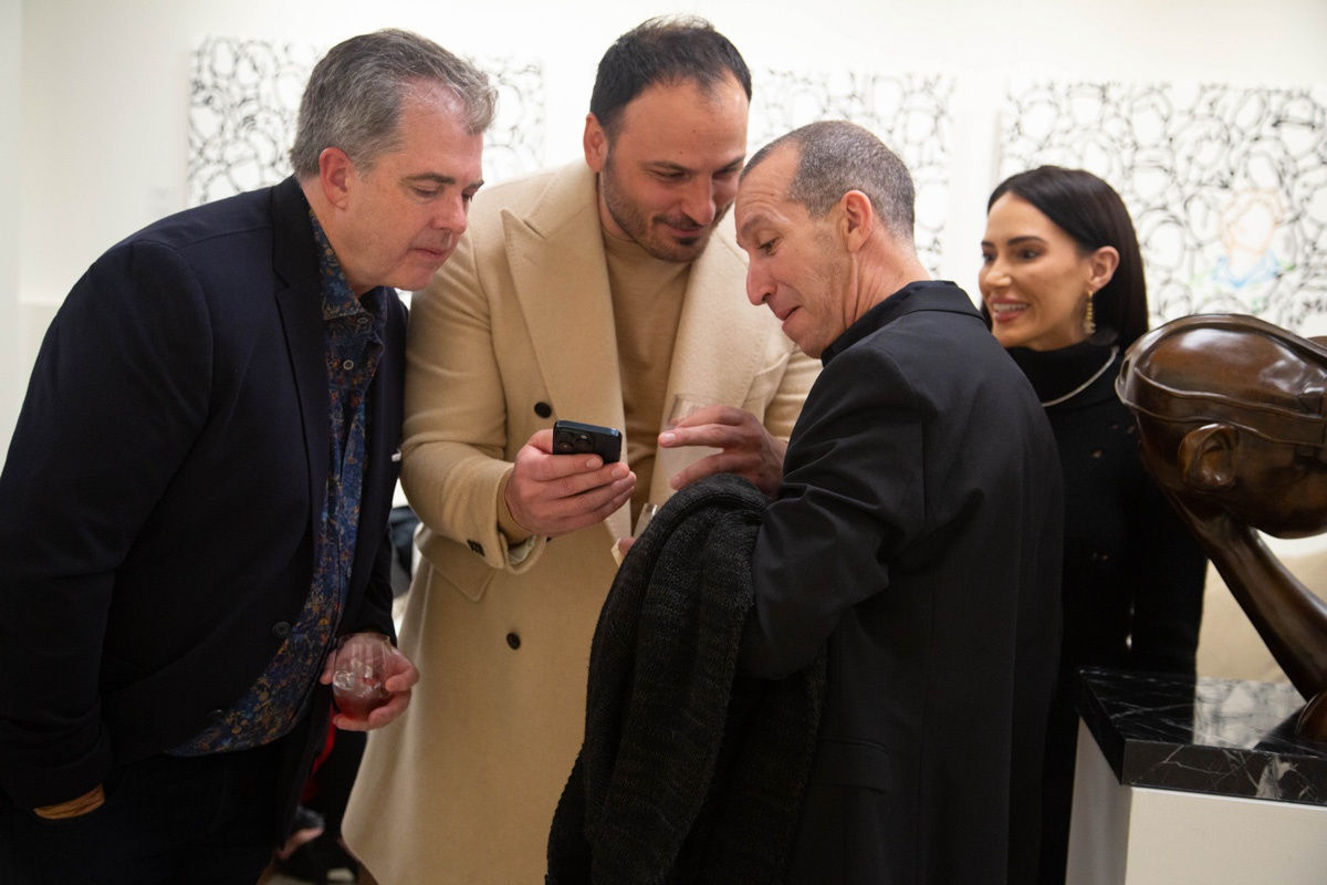 People in Carousel Fine Art's Atlanta gallery space during the spotlight exhibition for John Westbay titled "Love, Outside the Lines."
