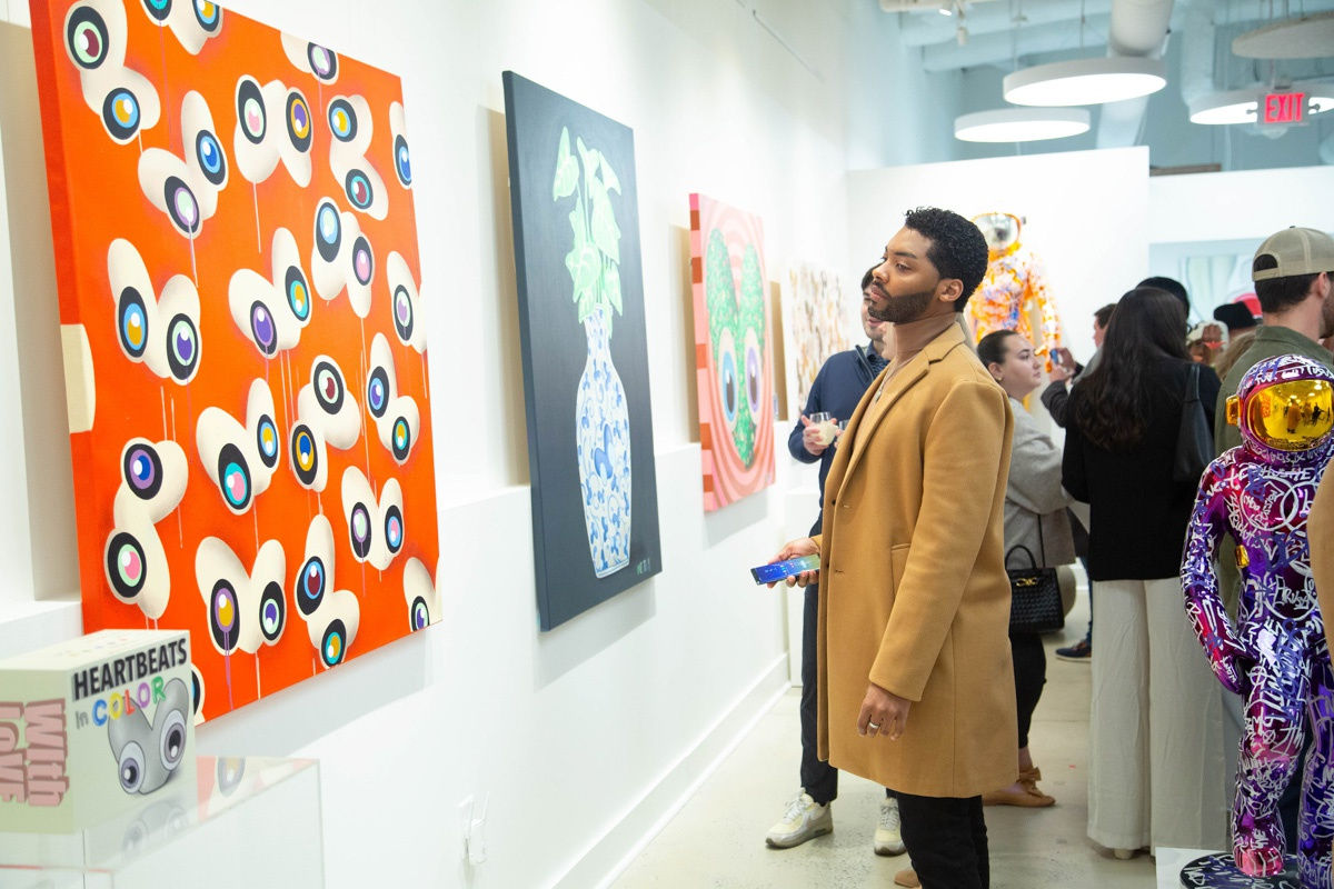 Man staring at painting by John Westbay in Carousel Fine Art's Atlanta gallery space during the spotlight exhibition for John Westbay titled "Love, Outside the Lines."