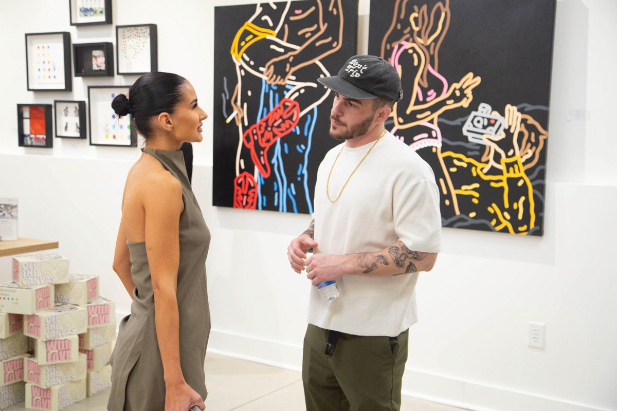 People in Carousel Fine Art's Atlanta gallery space during the spotlight exhibition for John Westbay titled "Love, Outside the Lines."