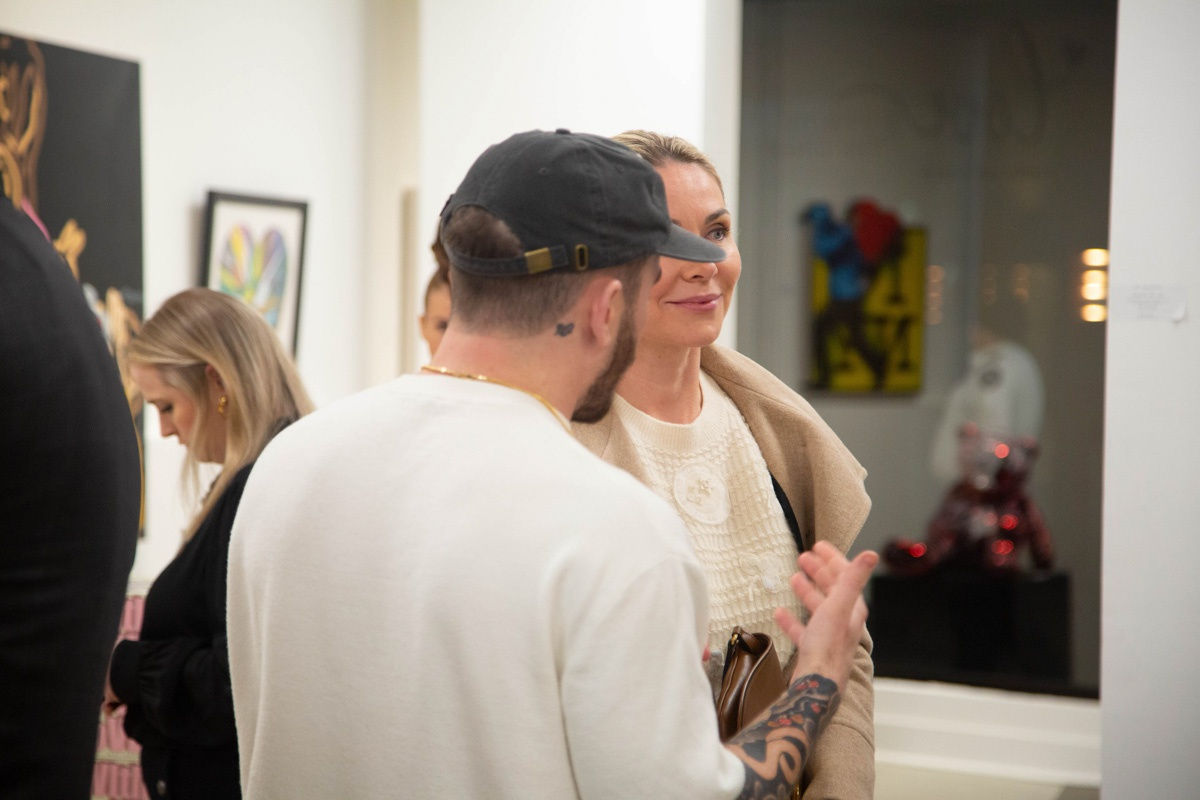 People in Carousel Fine Art's Atlanta gallery space during the spotlight exhibition for John Westbay titled "Love, Outside the Lines."