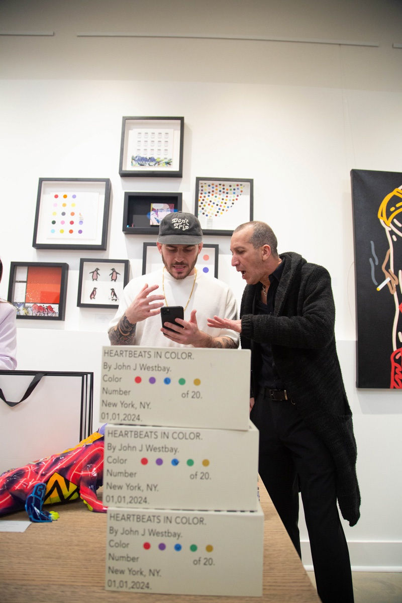 People in Carousel Fine Art's Atlanta gallery space during the spotlight exhibition for John Westbay titled "Love, Outside the Lines."