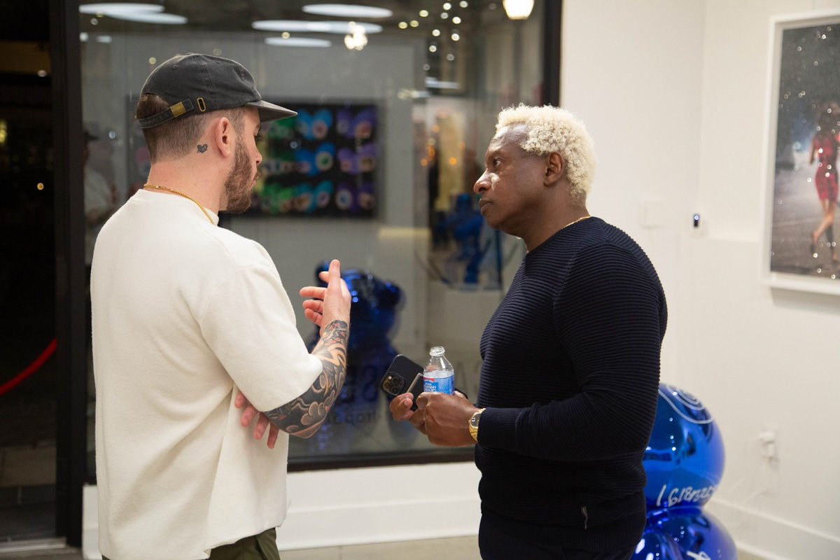 People in Carousel Fine Art's Atlanta gallery space during the spotlight exhibition for John Westbay titled "Love, Outside the Lines."