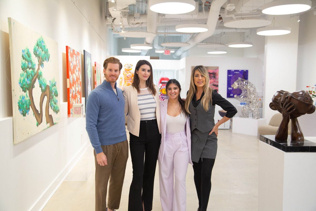 People in Carousel Fine Art's Atlanta gallery space during the spotlight exhibition for John Westbay titled "Love, Outside the Lines."
