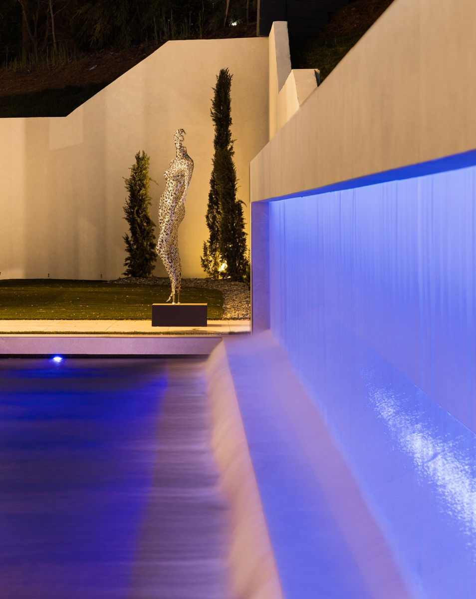 Backyard of a luxury modern home in Atlanta, GA with a pool.