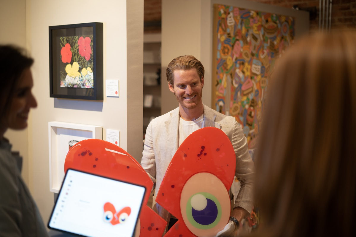 People in Carousel Fine Art's Chicago location during the Chicago Grand Opening.