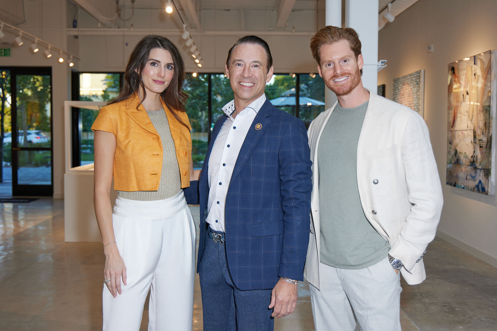 Owner and collector smiling together for a photo at Carousel Fine Art’s West Palm Beach NORA grand opening.