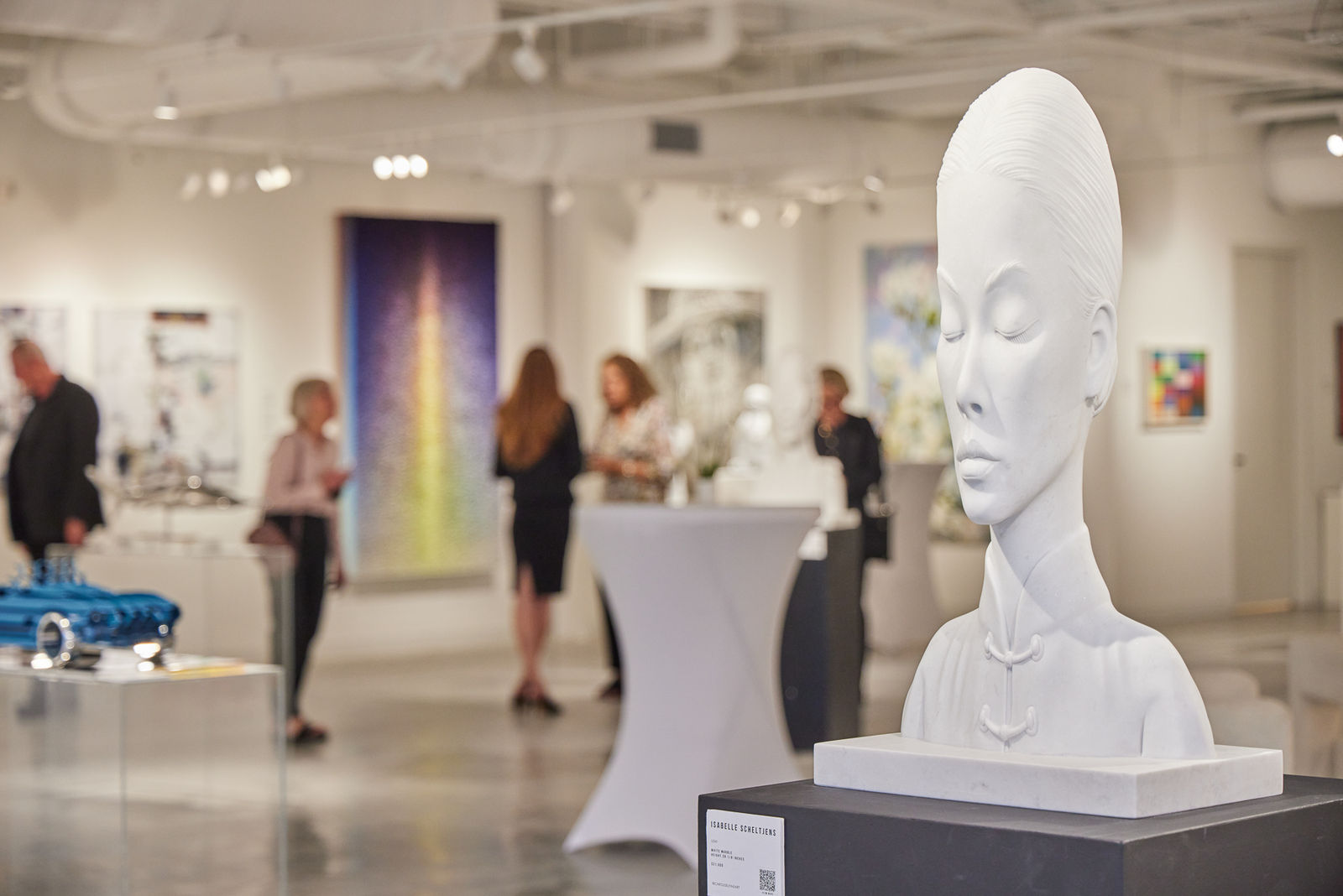 Grand opening crowd at our West Palm Beach art gallery in the NORA District, surrounded by contemporary works on every wall.