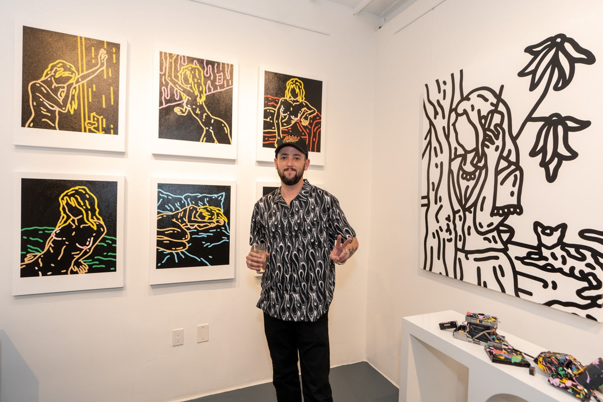 People at Carousel Fine Art's gallery space in Miami, FL during Chance Cooper's Spotlight Exhibition, "Between Me and You."