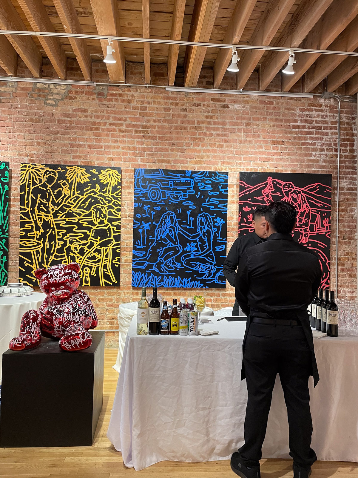 People around table for Collector's Dinner at Carousel Fine Art's gallery space in Chicago.