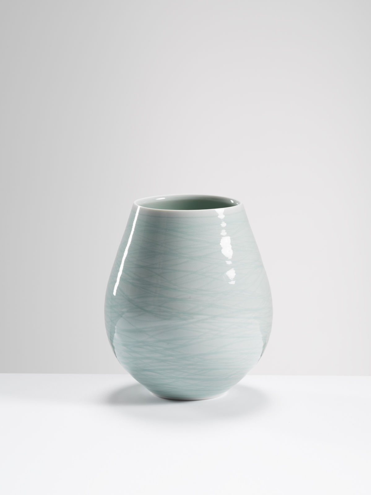Chris Keenan, 80 celadon ‘egg’ vase with incised wave decoration