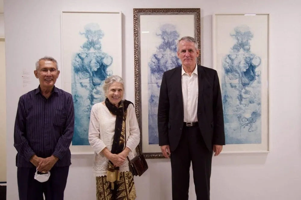 Ilse Noor together with her husband, Tengku Nazif Tengku Mohd Noor (L) and HE Dr. Peter Blomeyer, German ambassador to Malaysia (R), at the launch of the Creation exhibition at CULT Gallery. They are standing in front of three renditions of Ilse’s latest work, “Creation.”