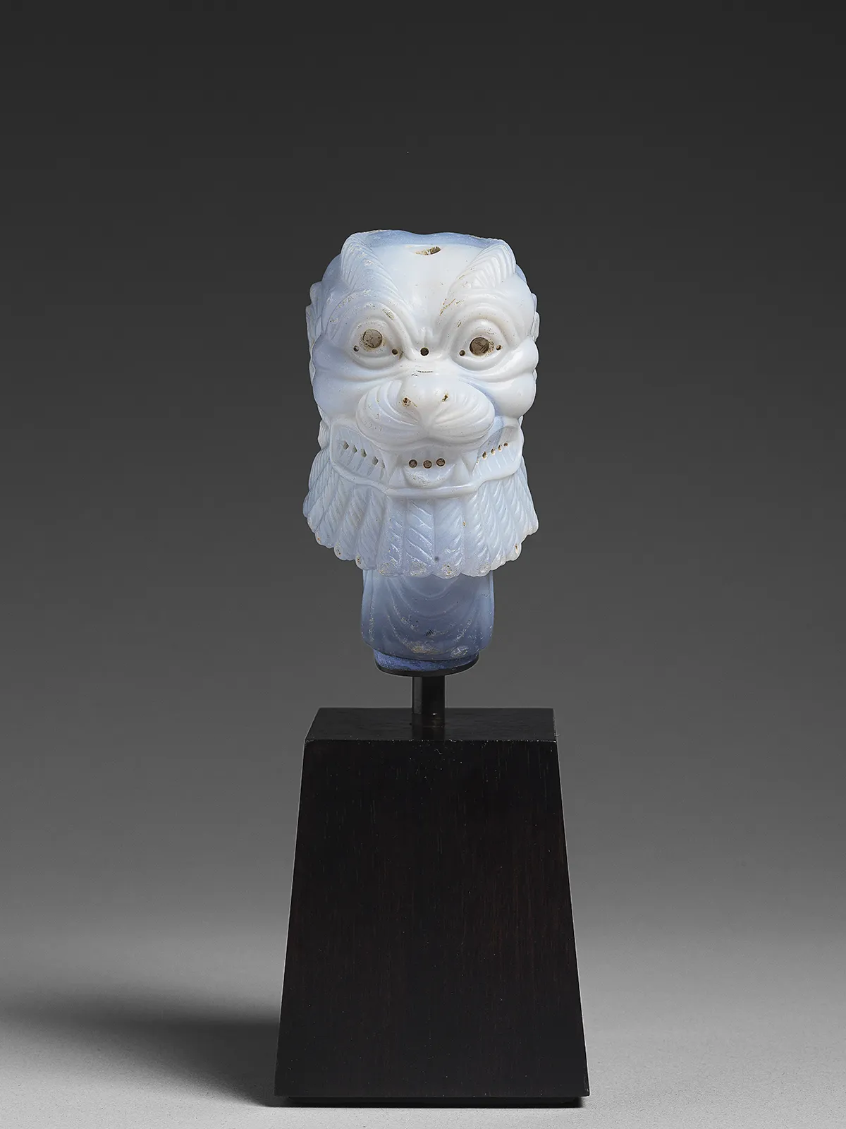 Head of Pazuzu, neo-assyrian, 7th century BC, chalcedony; h. 12 cm