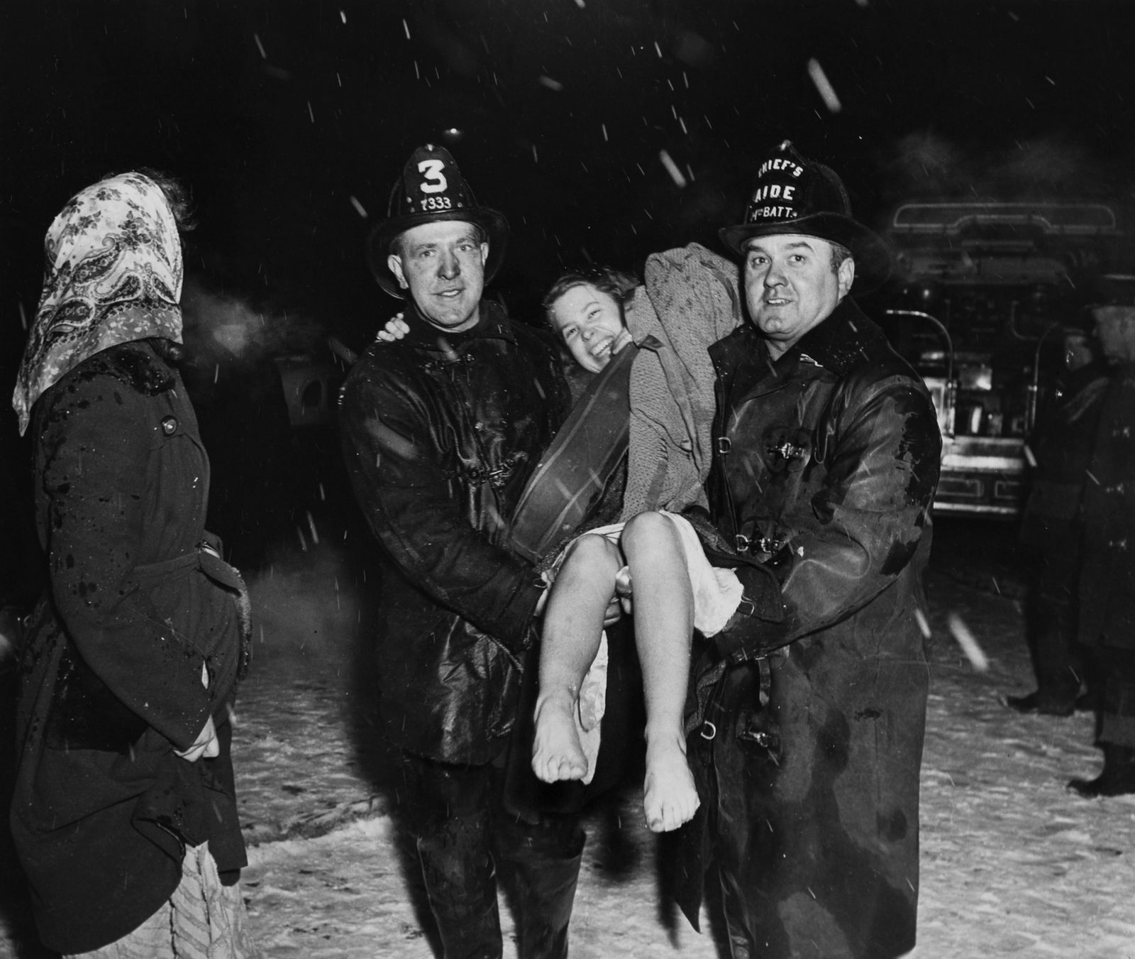 Weegee, The girl was happy. Not only was she rescued, but her precious violin too, 1945 ca.