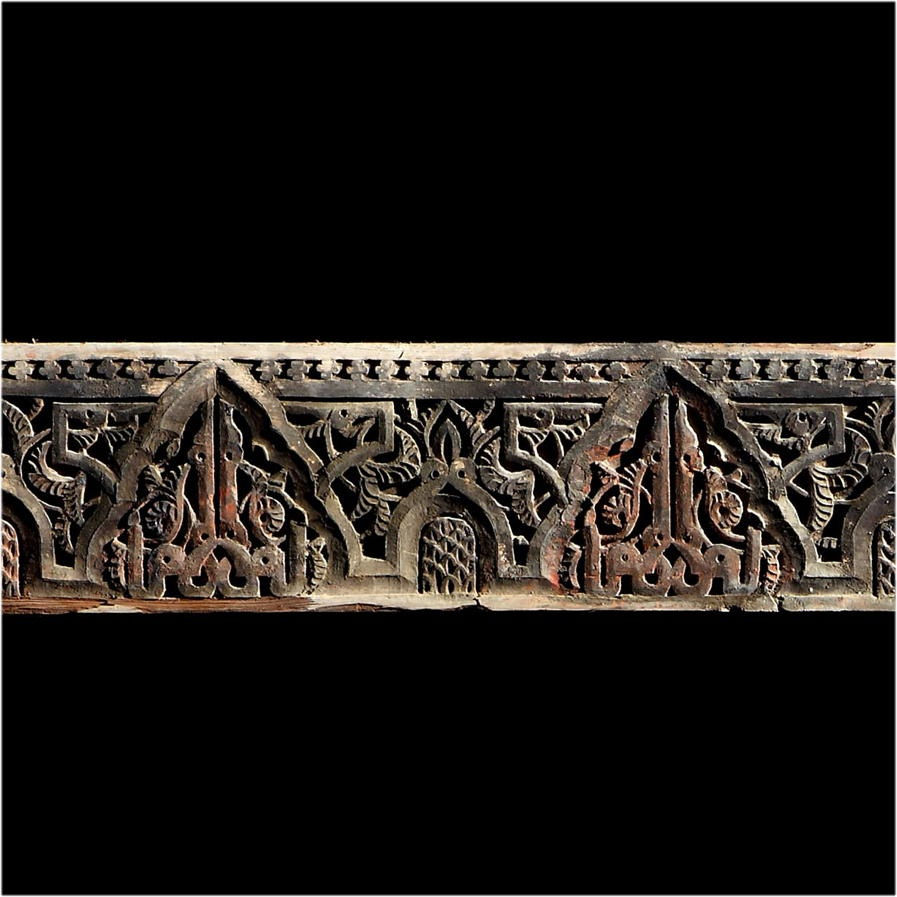 A LONG CARVED WOOD BEAM