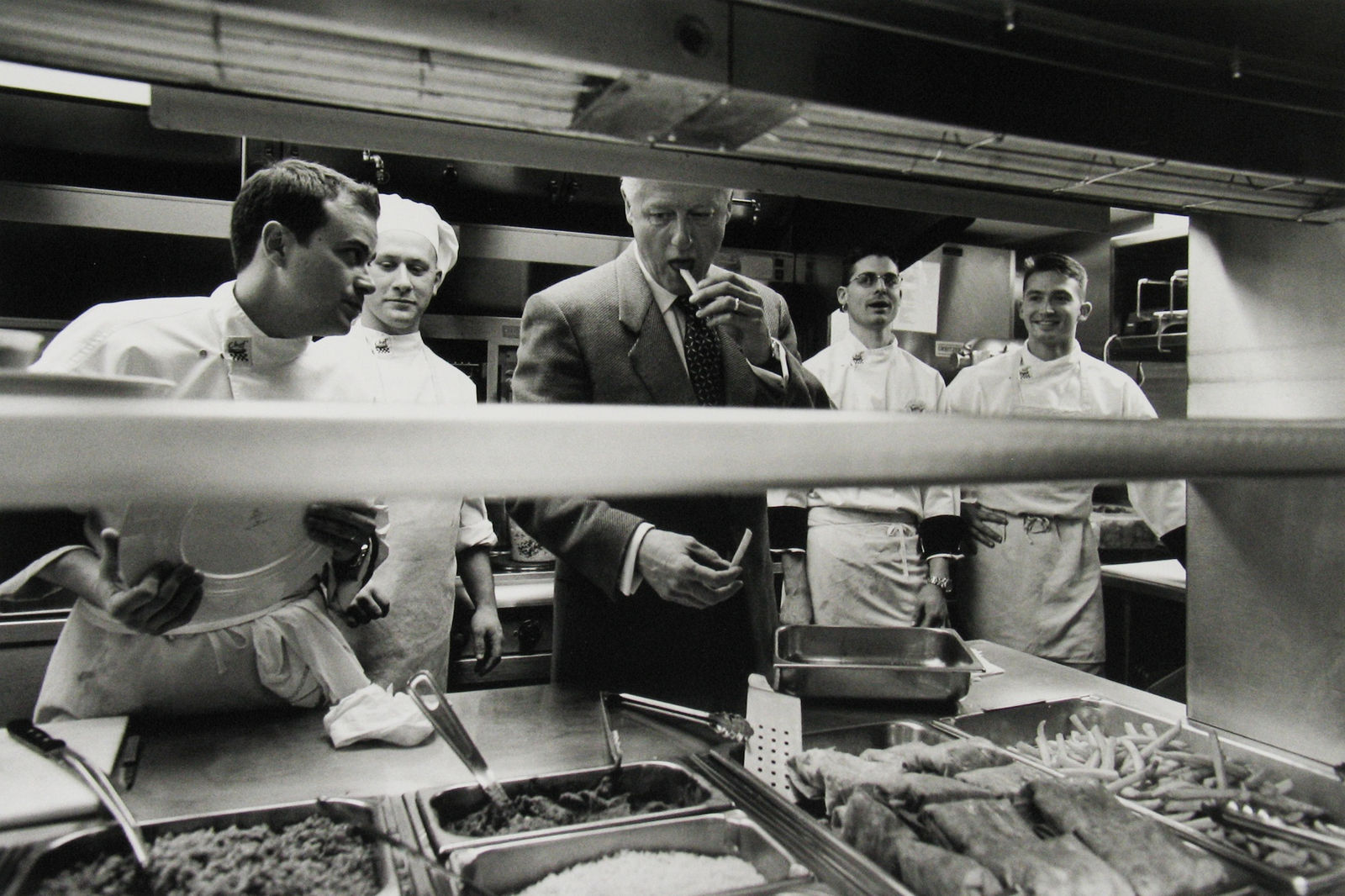 Diana Walker, President Clinton stops in to say thank you to the cooks in the White House mess, January 18, 2001