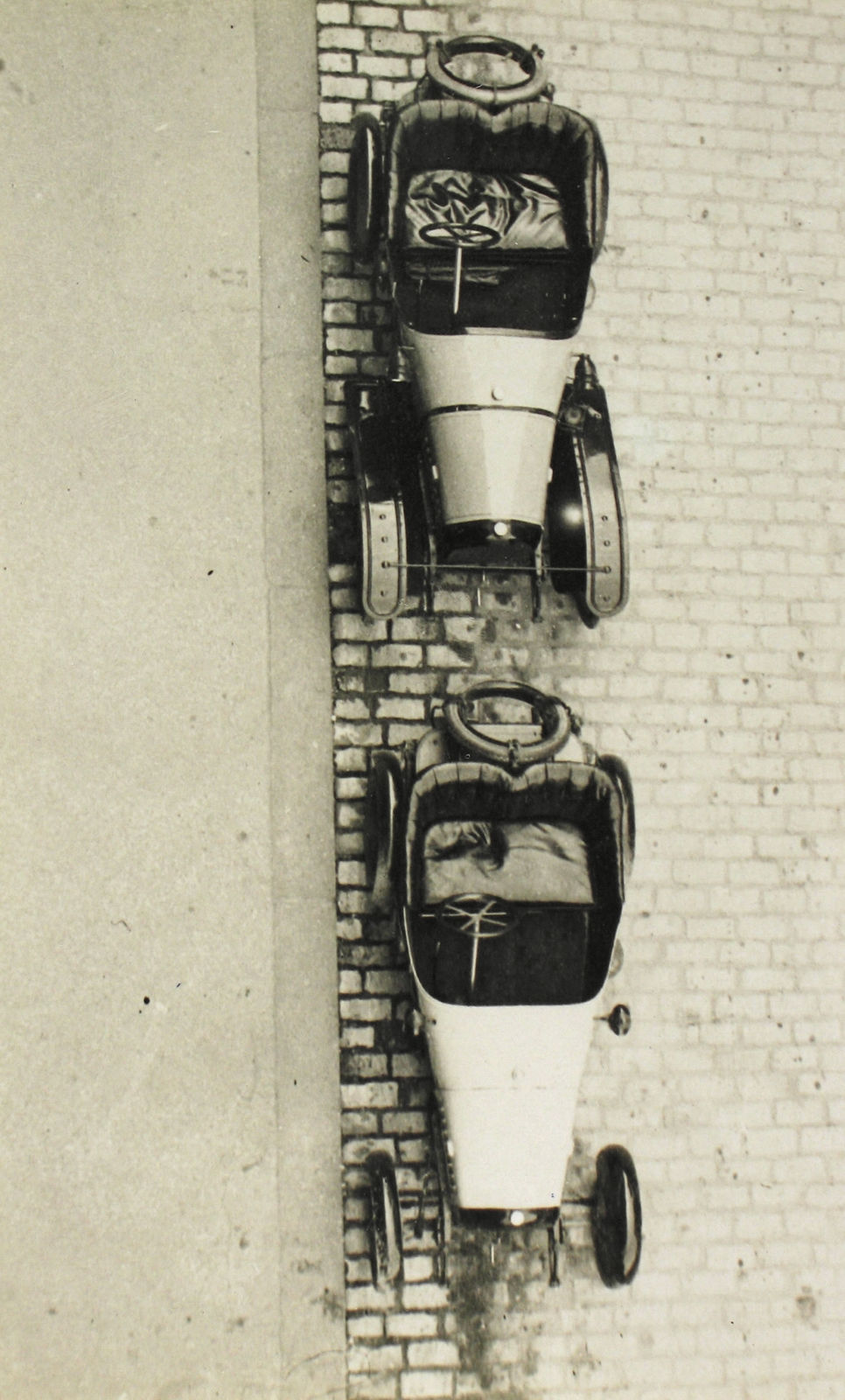 Jacques-Henri Lartigue, From another view: Simon's and my small Peugeots seen from my window on Rue Leroux, Paris, 1915