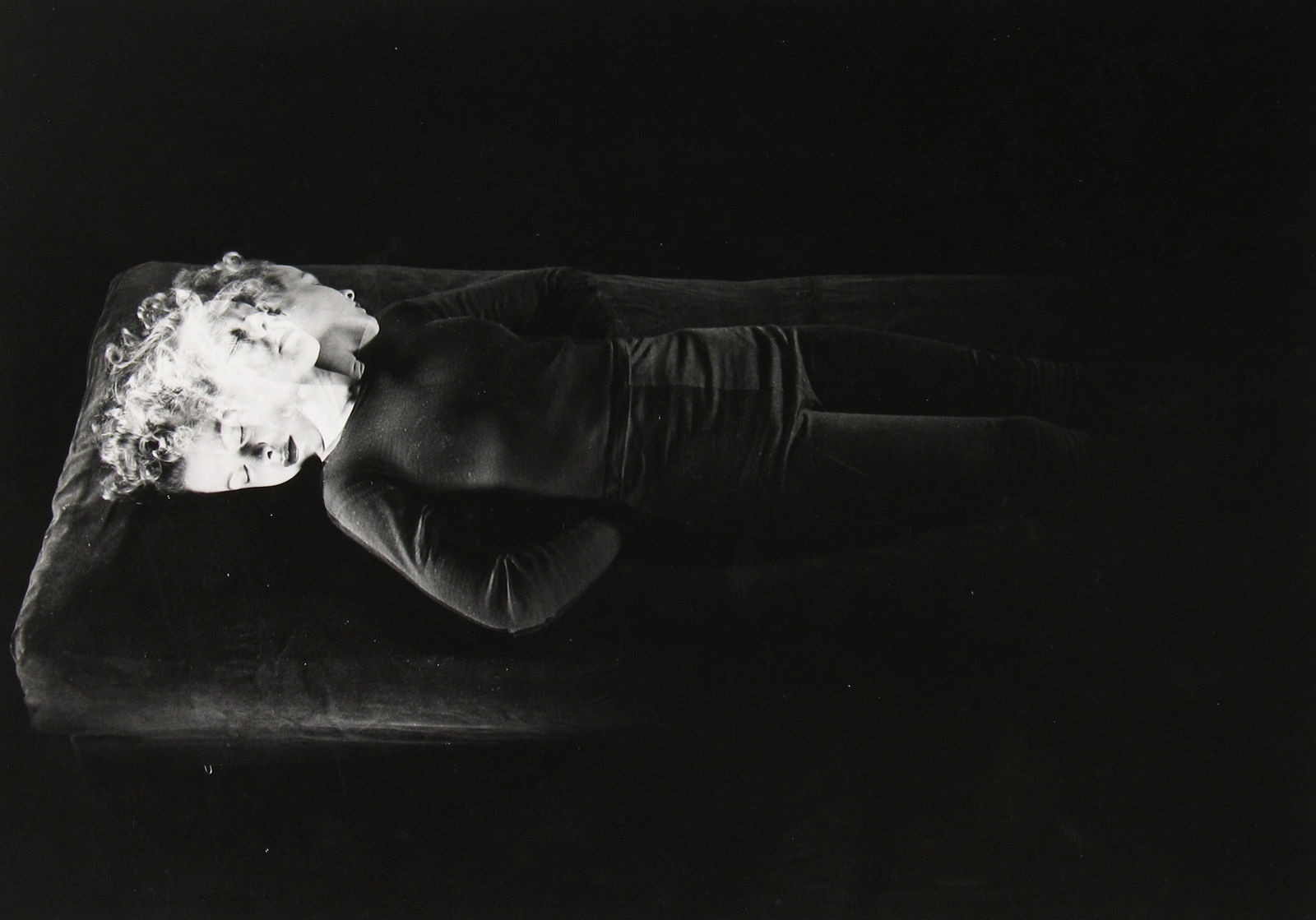 Gjon Mili, Stroboscopic image of woman lying on back turning head from side to side during sleep and relaxation study, NY, 1943