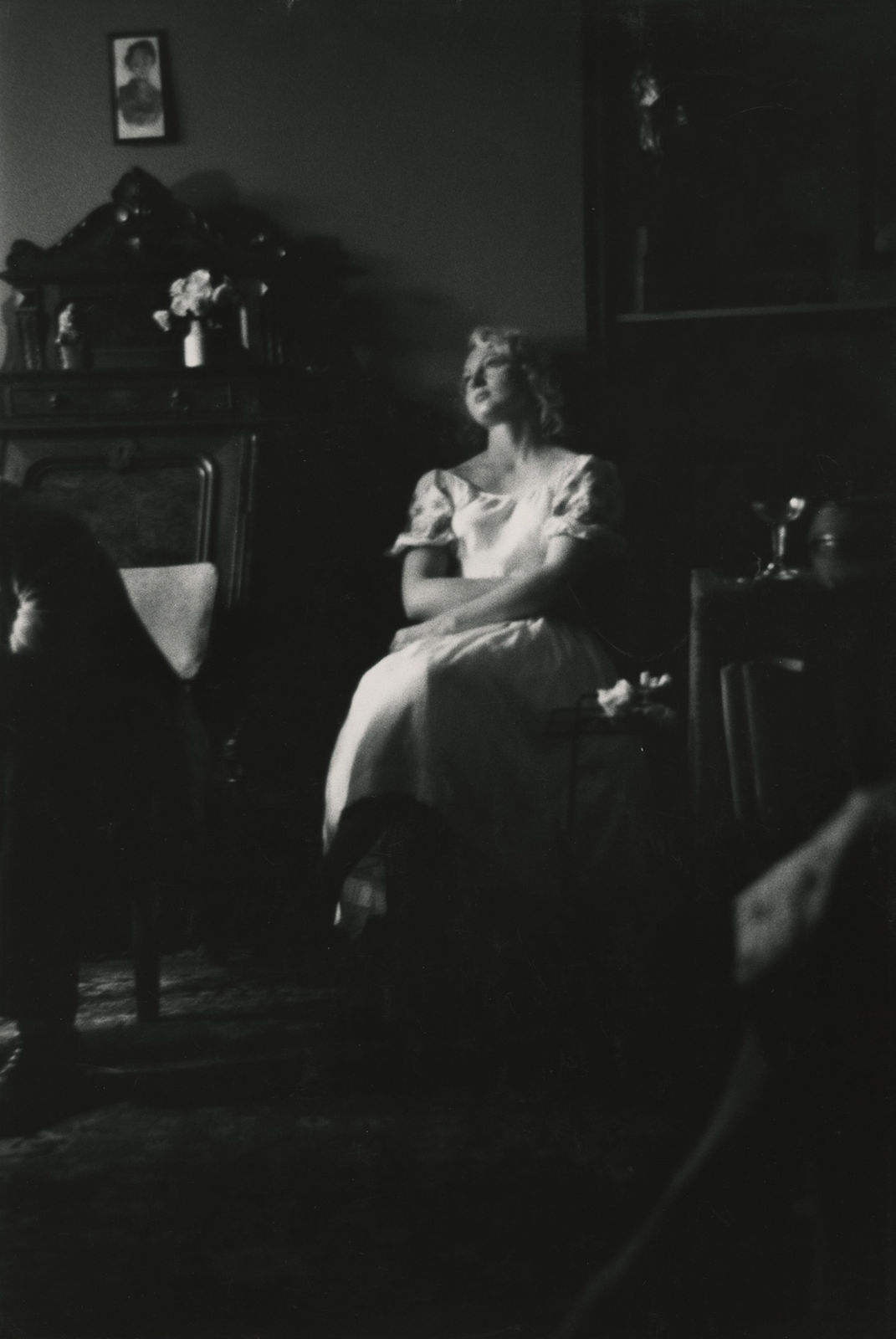 Larry Siegel, Seated woman in white dress, NYC, 1960