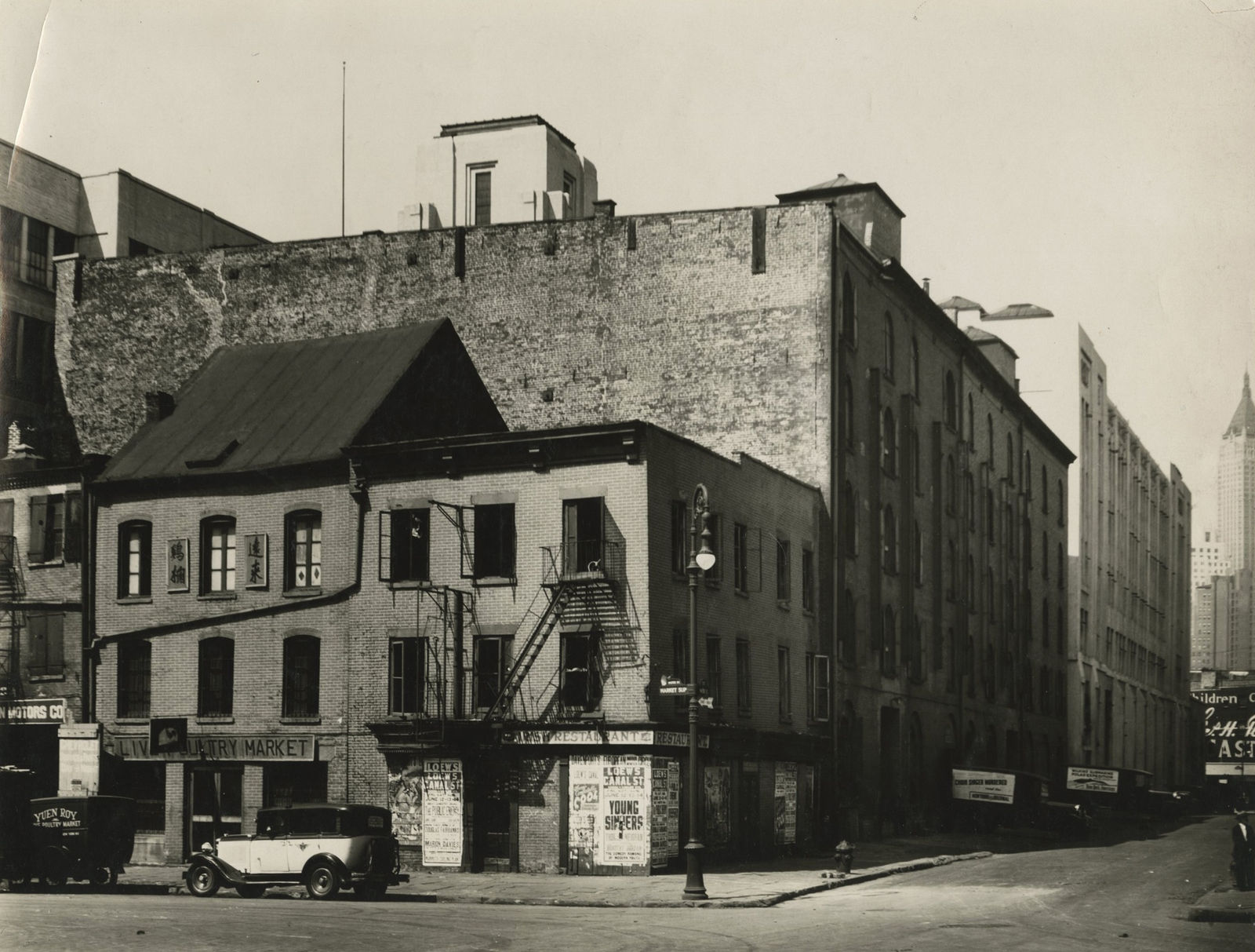 Berenice Abbott, Corner of Market Slip with “Young Sinners” poster, Manhattan, c.1935