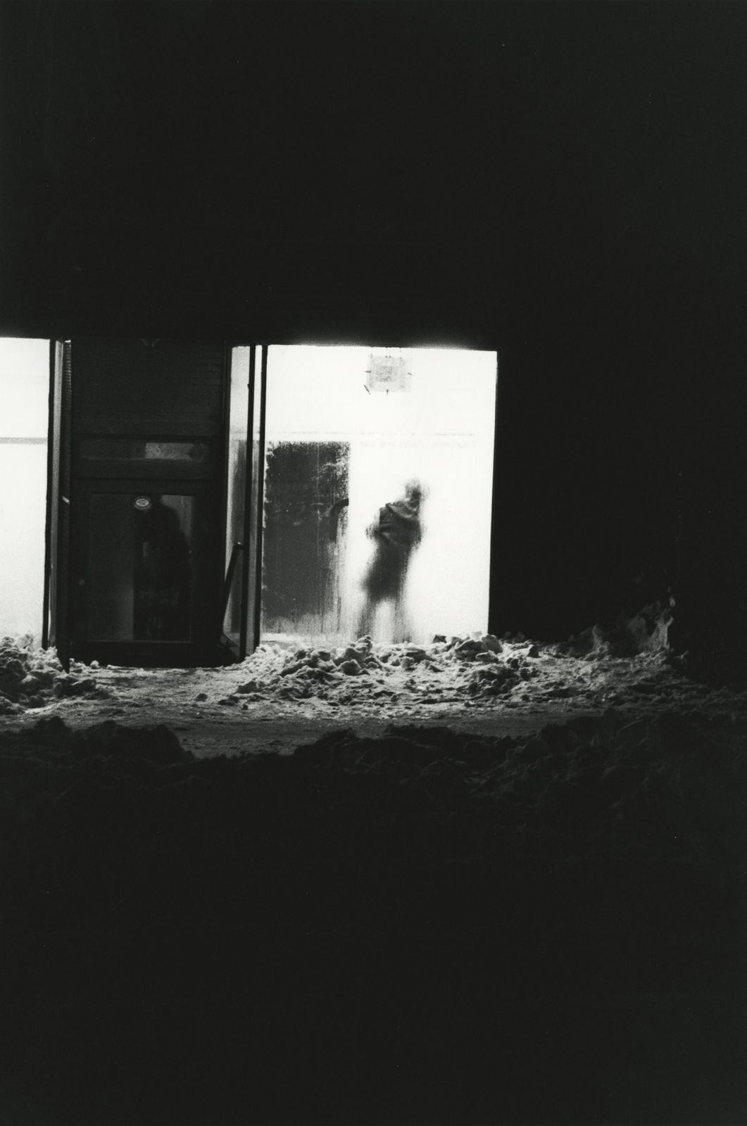 Larry Siegel, Man Passing Dorway, Snow, New York, 1956