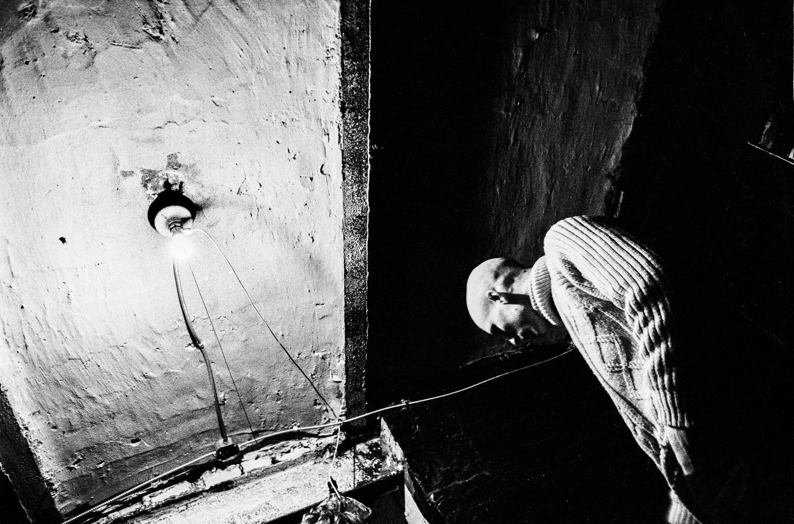 Ken Schles, Craig In Basement With Bare Lightbulb, 1984