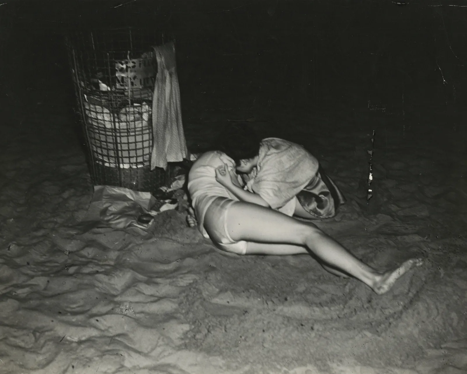 Weegee, Untitled (lovers on sand), c.1940s
