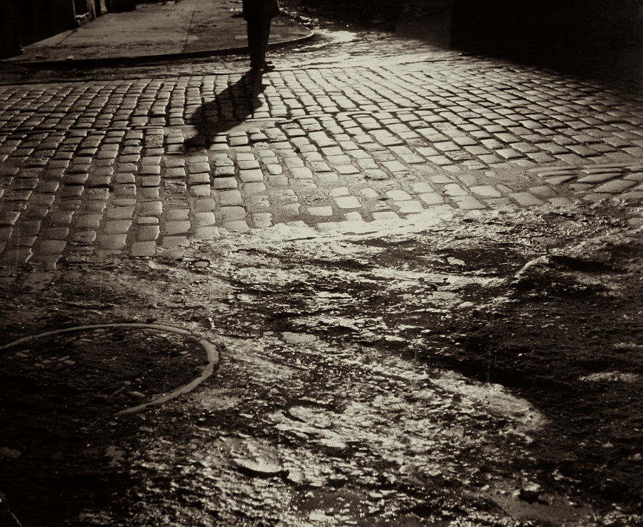 Morris Huberland, Untitled (man standing on cobbled street), c.1950