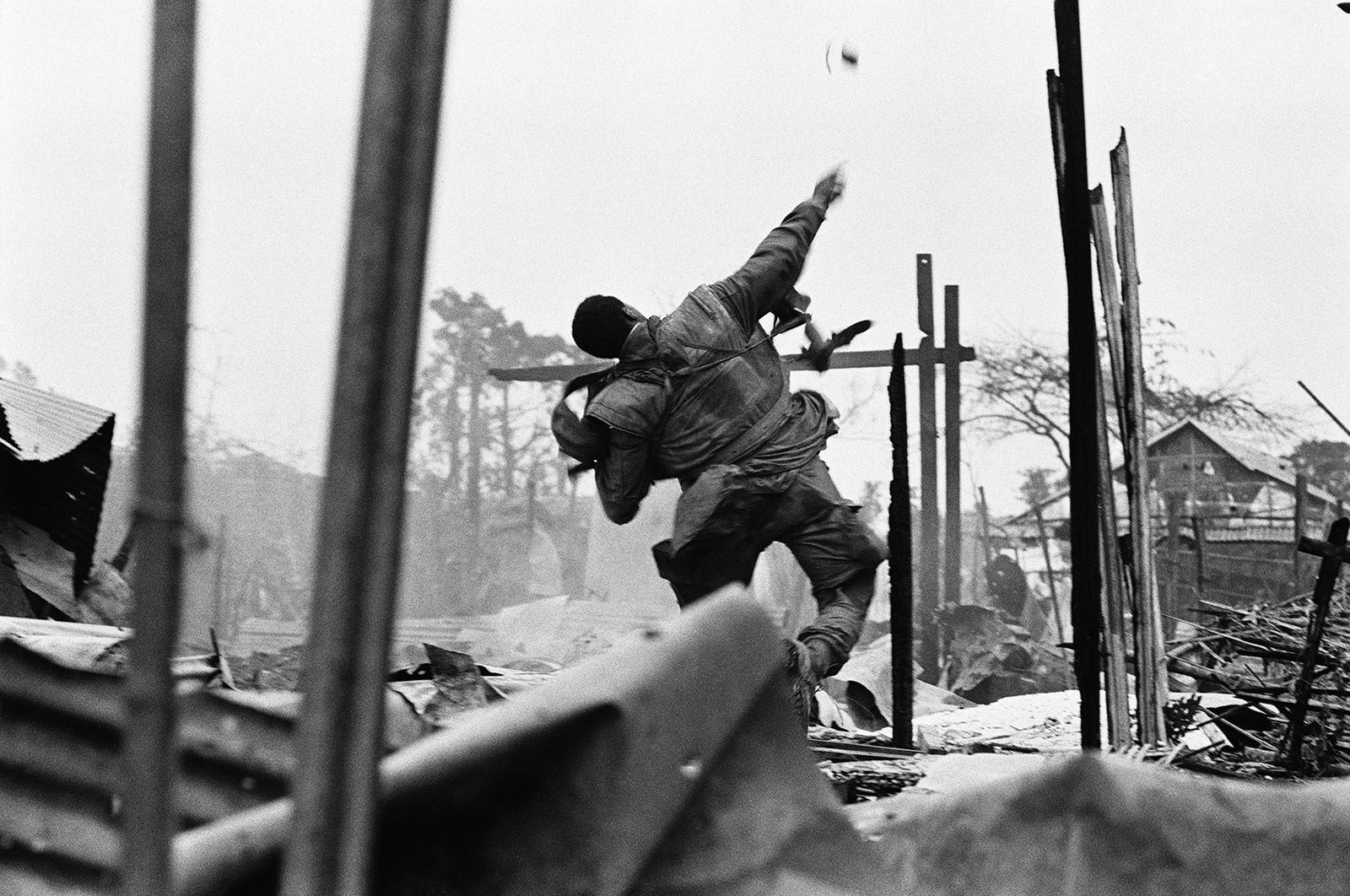 Don McCullin, US Marine Hurling a Grenade Seconds before Being Shot through the Left Hand, Hue, Vietnam, 1968